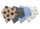 A set of four folded bandana bibs for babies, laid out on a white background. They are adorned with different patterns including a floral design and dots, in various colors such as blue and beige.