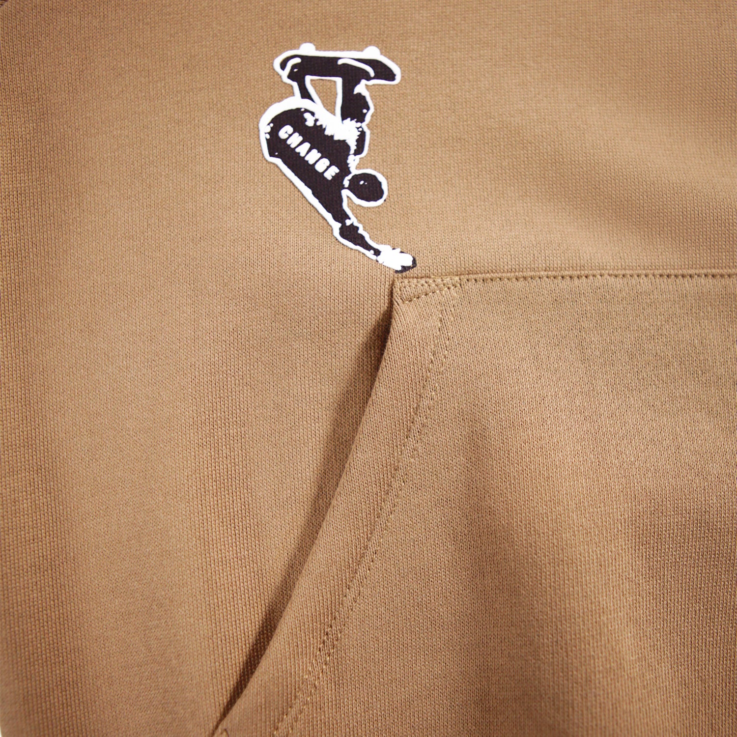 skater on pocket of brown sweatshirt 