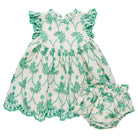 Green and white floral baby romper on a white background