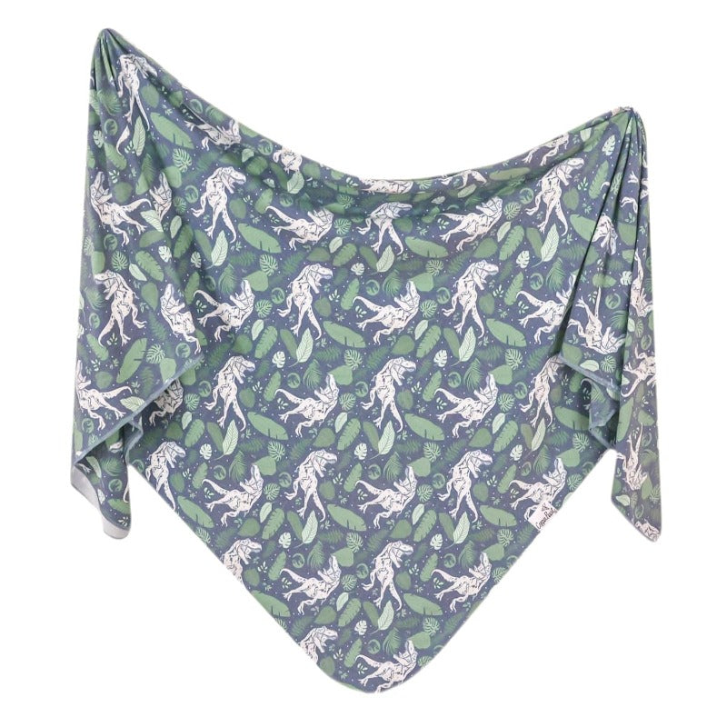 swaddle blanket with dinosaur and leaf print 