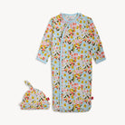 Floral baby onesie and hat set on a white background