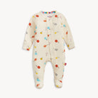 Baby onesie with colorful sport patterns on a white background