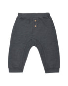 Dark gray baby pants with button details on a white background