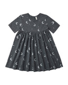 Dark gray twirl dress with moon pattern on a white background