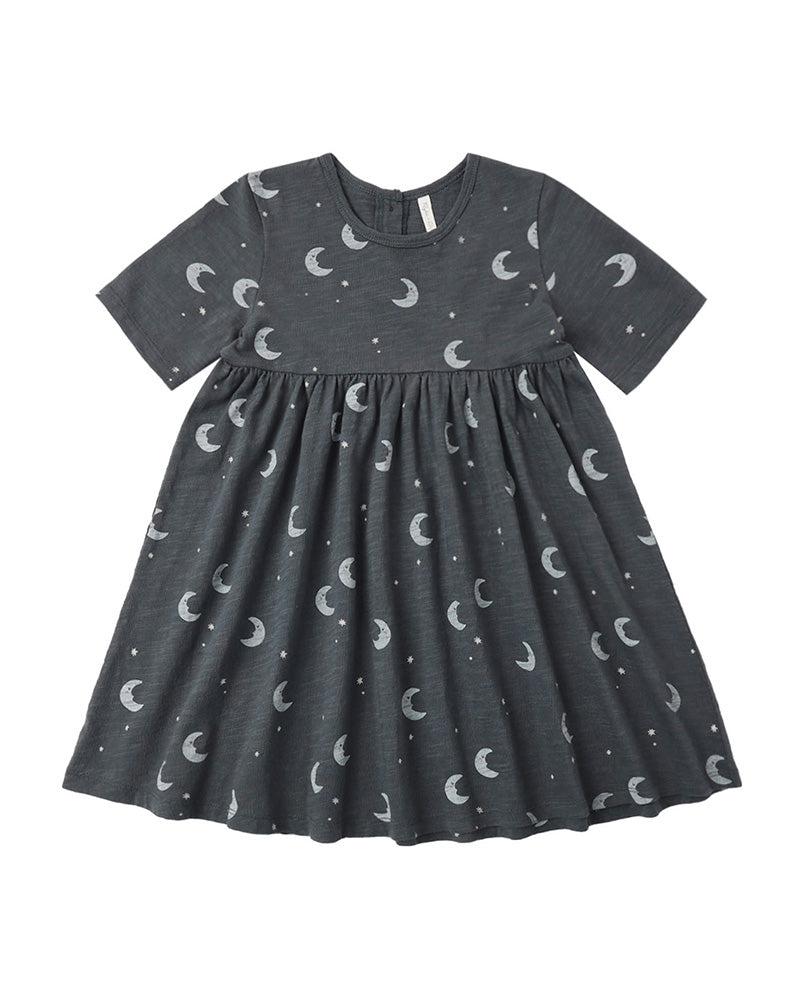 Dark gray twirl dress with moon pattern on a white background