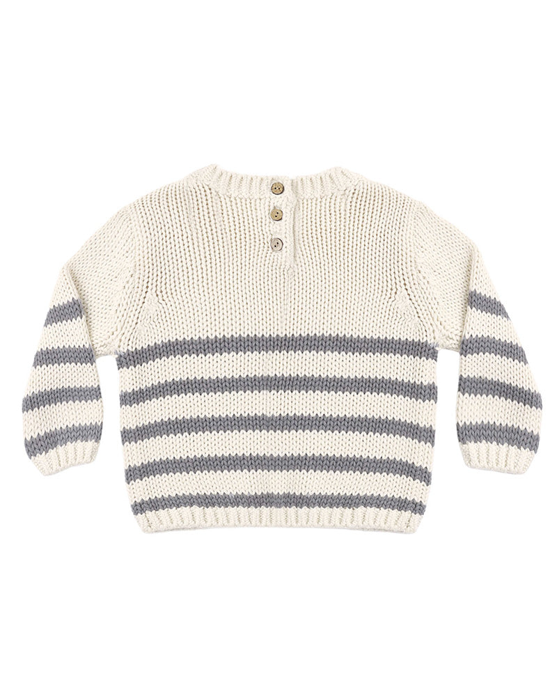 A cream-colored knit sweater with horizontal gray stripes across the lower half and sleeves, featuring a three-button henley neckline, shown against a plain white background.