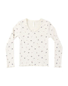 White ribbed long-sleeve shirt with subtle floral pattern and lettuce trim on a white background