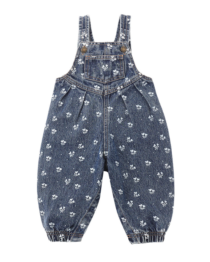 Blue denim overalls with floral pattern and front pocket on a white background