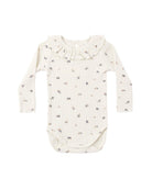 Baby onesie with floral pattern and a ruffled collar on a white background