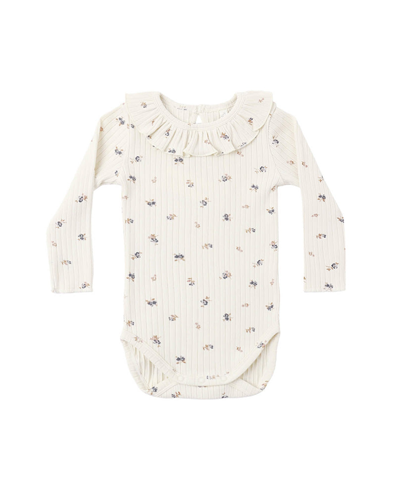 Baby onesie with floral pattern and a ruffled collar on a white background