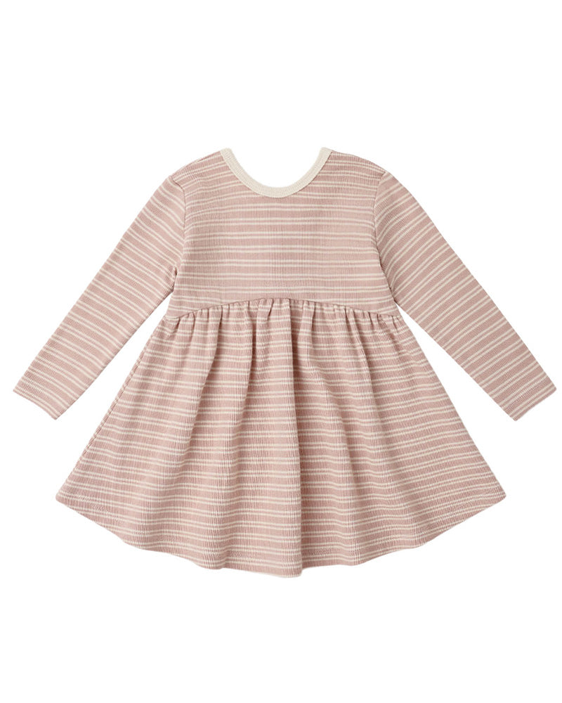 A long-sleeve baby dress with a pleated skirt, featuring horizontal stripes in dusty pink and cream, with a solid cream crew neck.