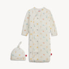 Baby gown with colorful patterns and matching hat on a white background
