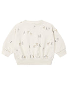 An off-white long-sleeve baby sweatshirt with a repeating pattern of small deer and pine trees in muted gray and beige, shown against a plain white background.