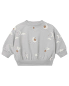 A light gray long-sleeve sweatshirt for toddlers, featuring an all-over celestial print of white clouds, crescent moons, and brown stars.
