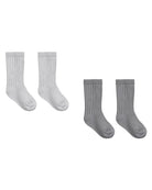 Two pairs of socks, one white and one gray on a white background