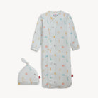 Baby gown with colorful patterns and matching hat on a white background