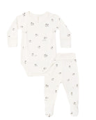 A baby casual set consisting of a long-sleeve bodysuit and matching footed pants in white, both featuring a small gray and black animal print.