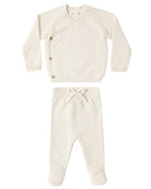 A baby knit two-piece outfit set in cream/off-white, featuring a long-sleeve wrap-style cardigan with brown buttons and matching footed pants with an elastic waist and bow.