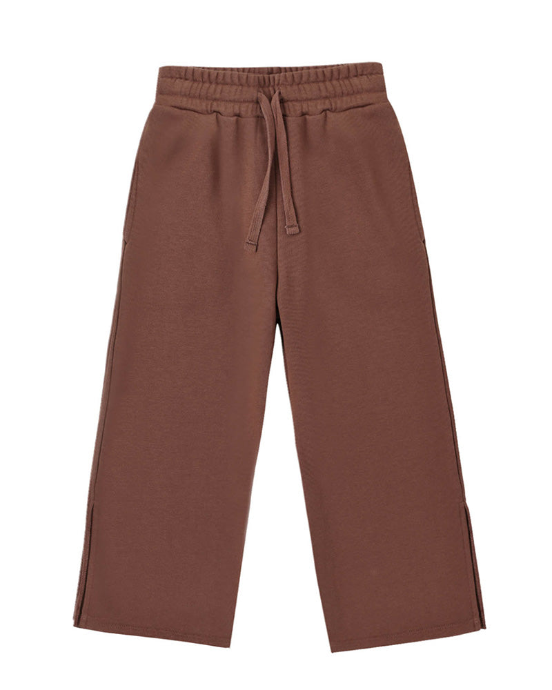 Brown wide leg pants with a drawstring on a white background