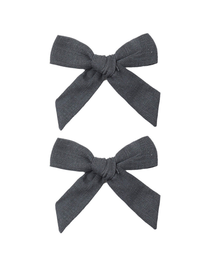 Two gray hair bows on a white background
