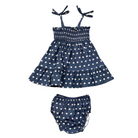 Navy blue dress with white star pattern and matching bloomers on a white background
