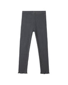 Dark ribbed leggings with ruffle detail on bottom against a white background