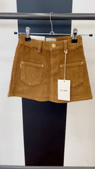 video of brown corduroy skirt on hanger 