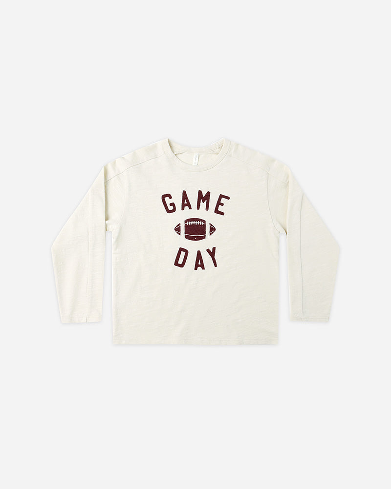 White sweatshirt with 'Game Day' text and football graphic on a white background